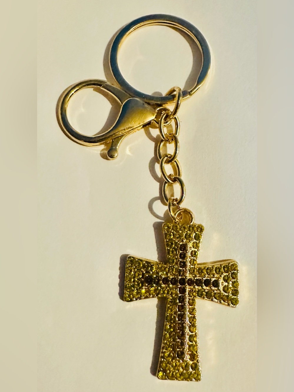 Gold Tone Cross Keychain with Yellow and Purple Crystals